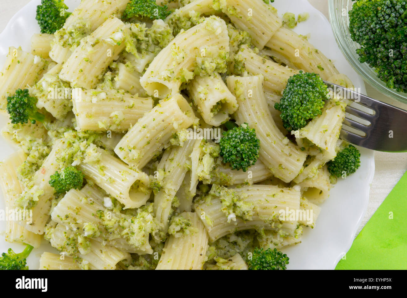 Cooked pasta with broccoli served with cooked broccoli close up Stock Photo