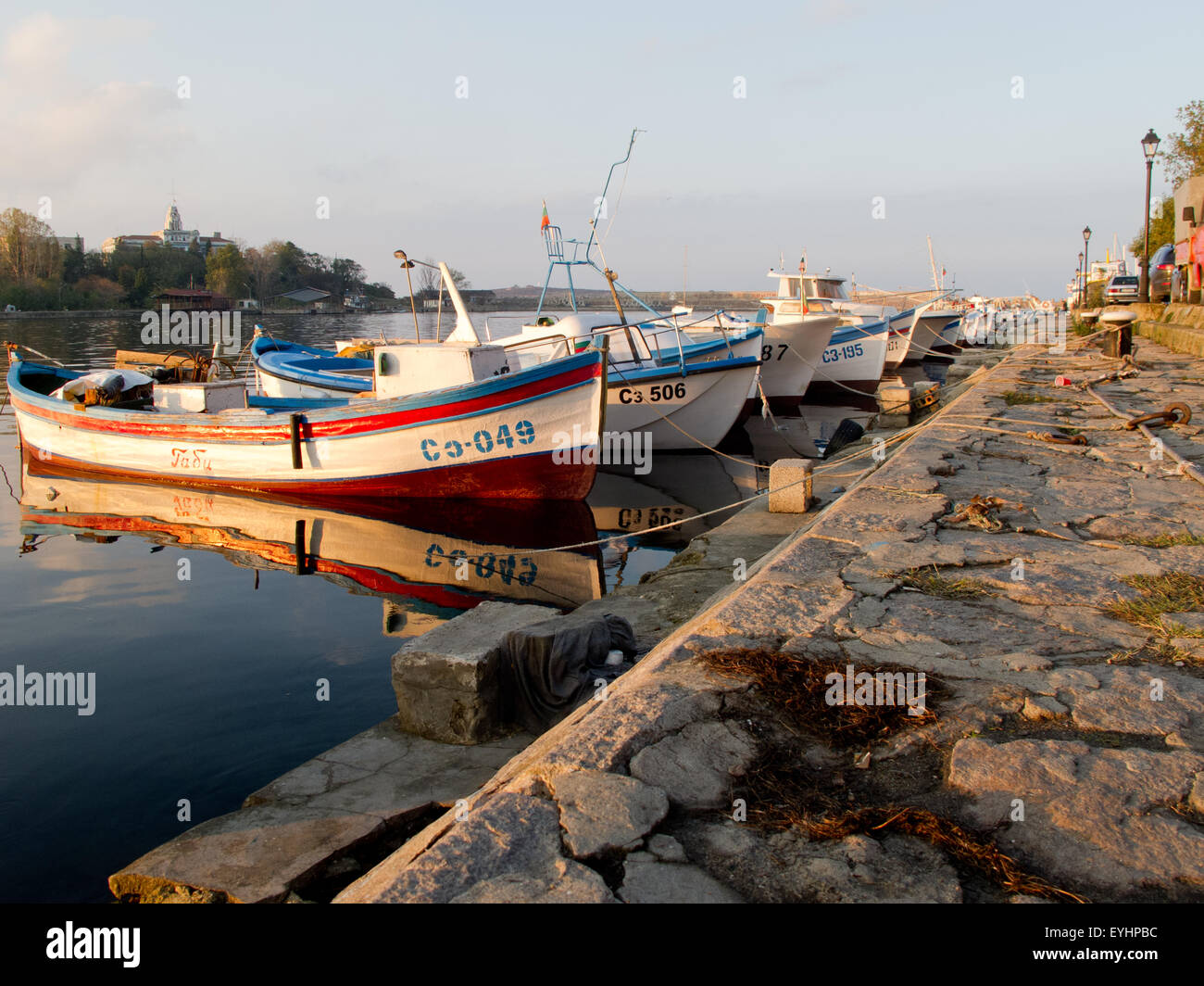 Fisherman boats on sunset Stock Photo - Alamy