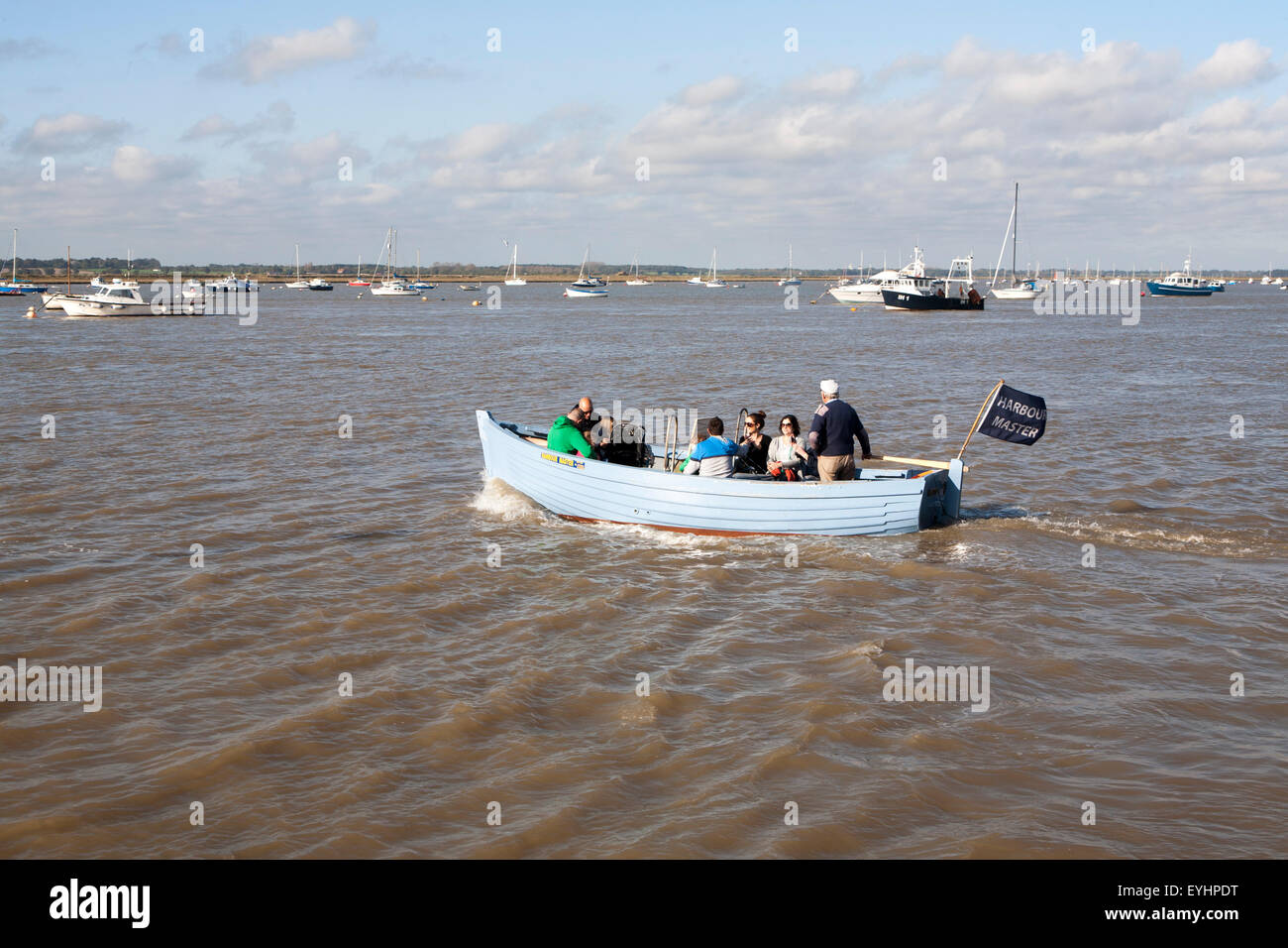 Small ferry boat crossing River Deben between Bawdsey Quay and