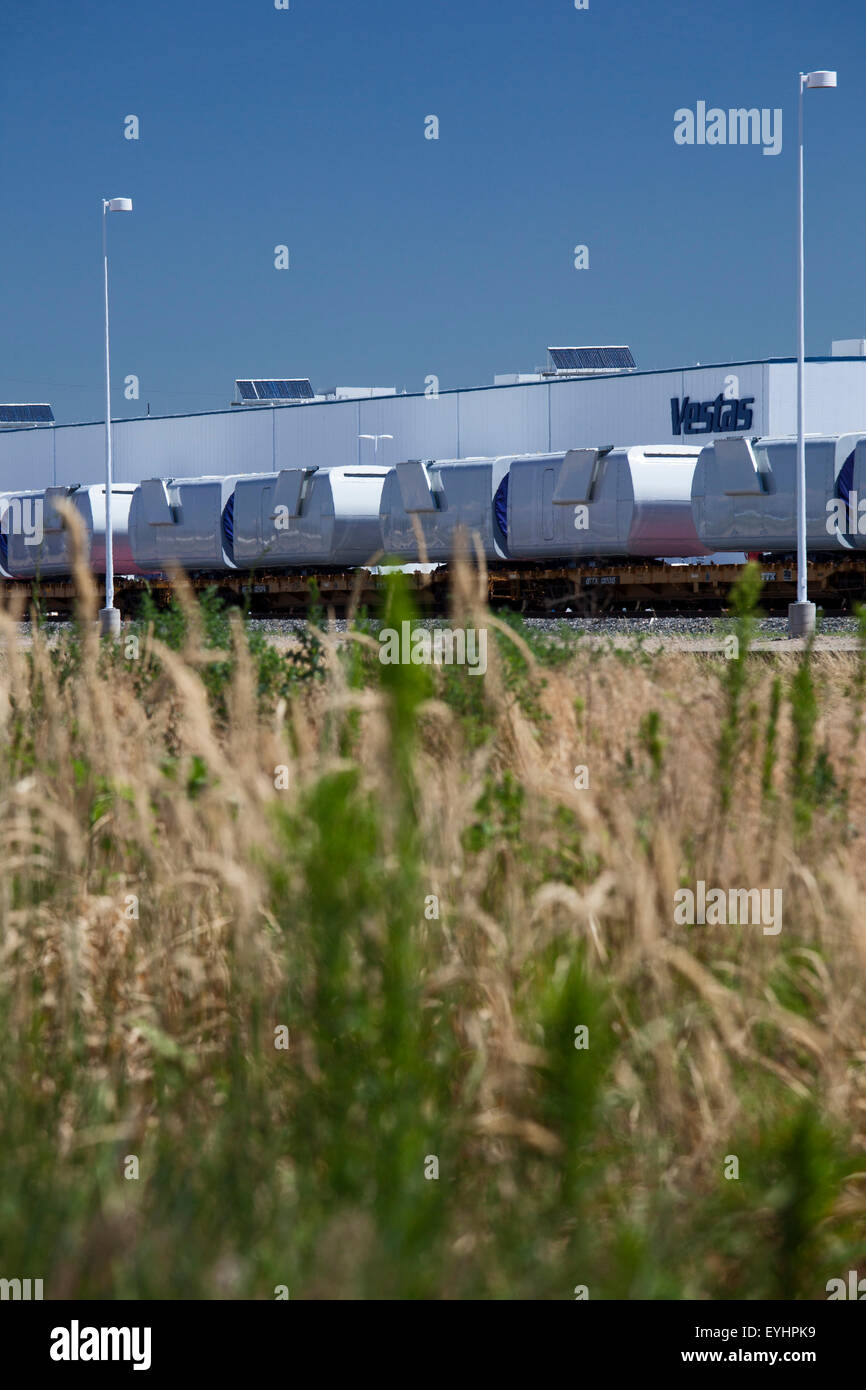 Brighton, Colorado - Nacelles for wind turbines on rail cars outside the Vestas Wind Systems factory. Stock Photo