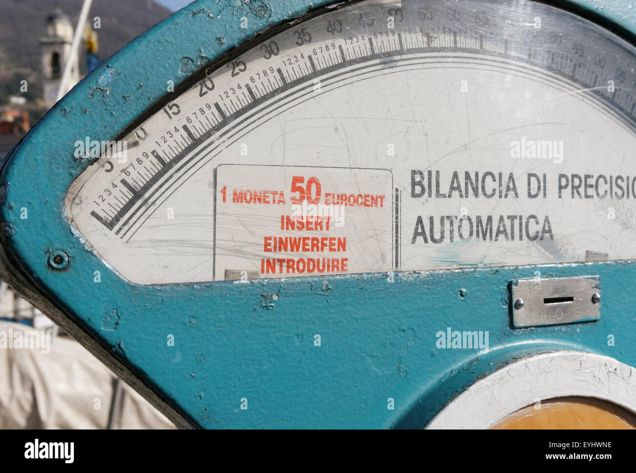Old coin operated weigh scale in Italy Stock Photo