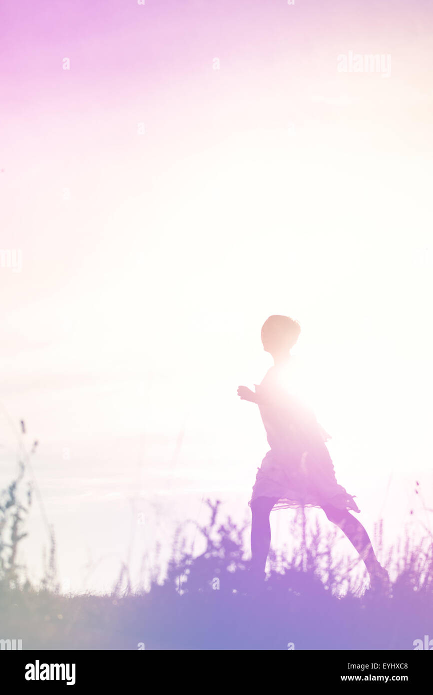 Woman Running to Freedom Through Countryside Field, Escape, Breakout Concept, Silhouette of Female Person, Double Exposure Stock Photo