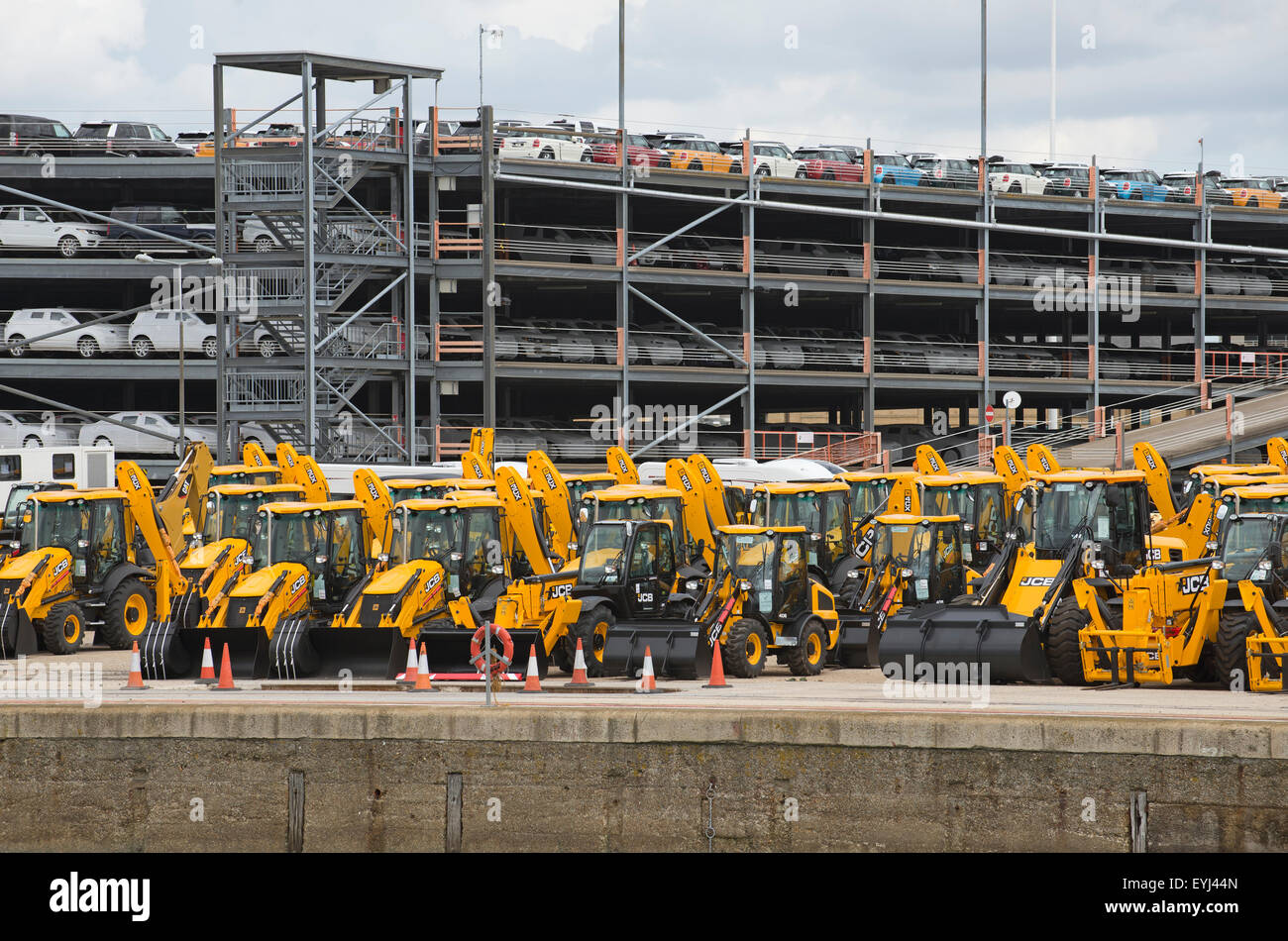 Cargo of tractors and cars for export from the UK on the docks at Southampton UK await shipping Stock Photo
