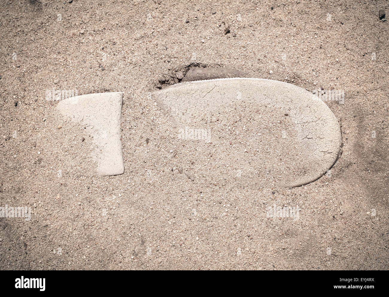 Sole of a shoe on the sand, symbol travel, trip, journey Stock Photo
