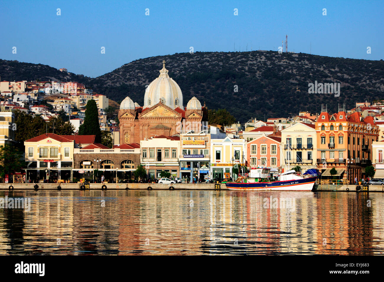 Capital city of Lesbos or Lesvos island, Mytilene and picturesque port reflections on sea surface. Stock Photo