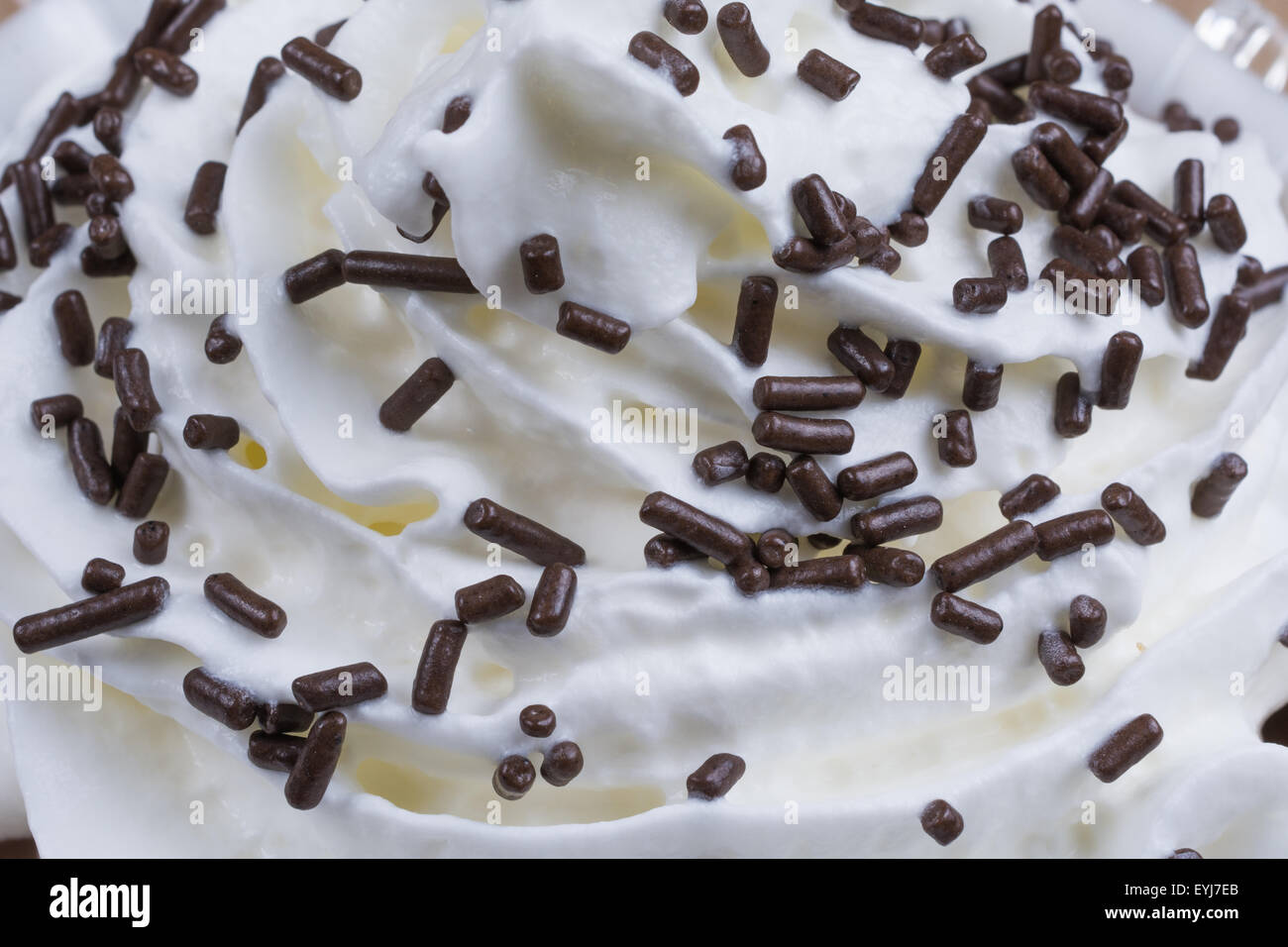 Whipped cream with chocolate sprinkles Stock Photo Alamy