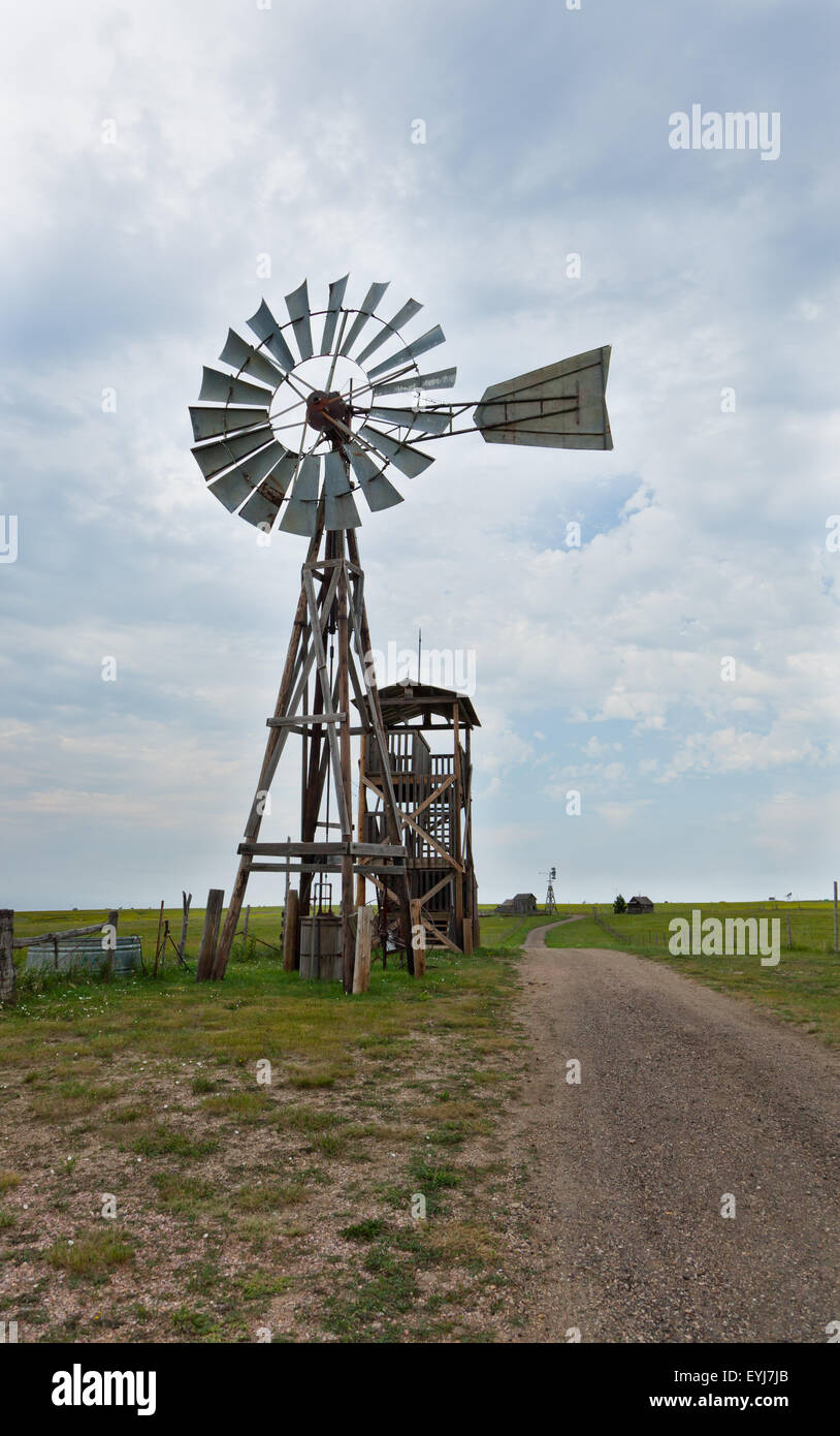 An old western windmill, used to pump water out of a well, made of wood and  metal on a prairie farm in South Dakota Stock Photo - Alamy