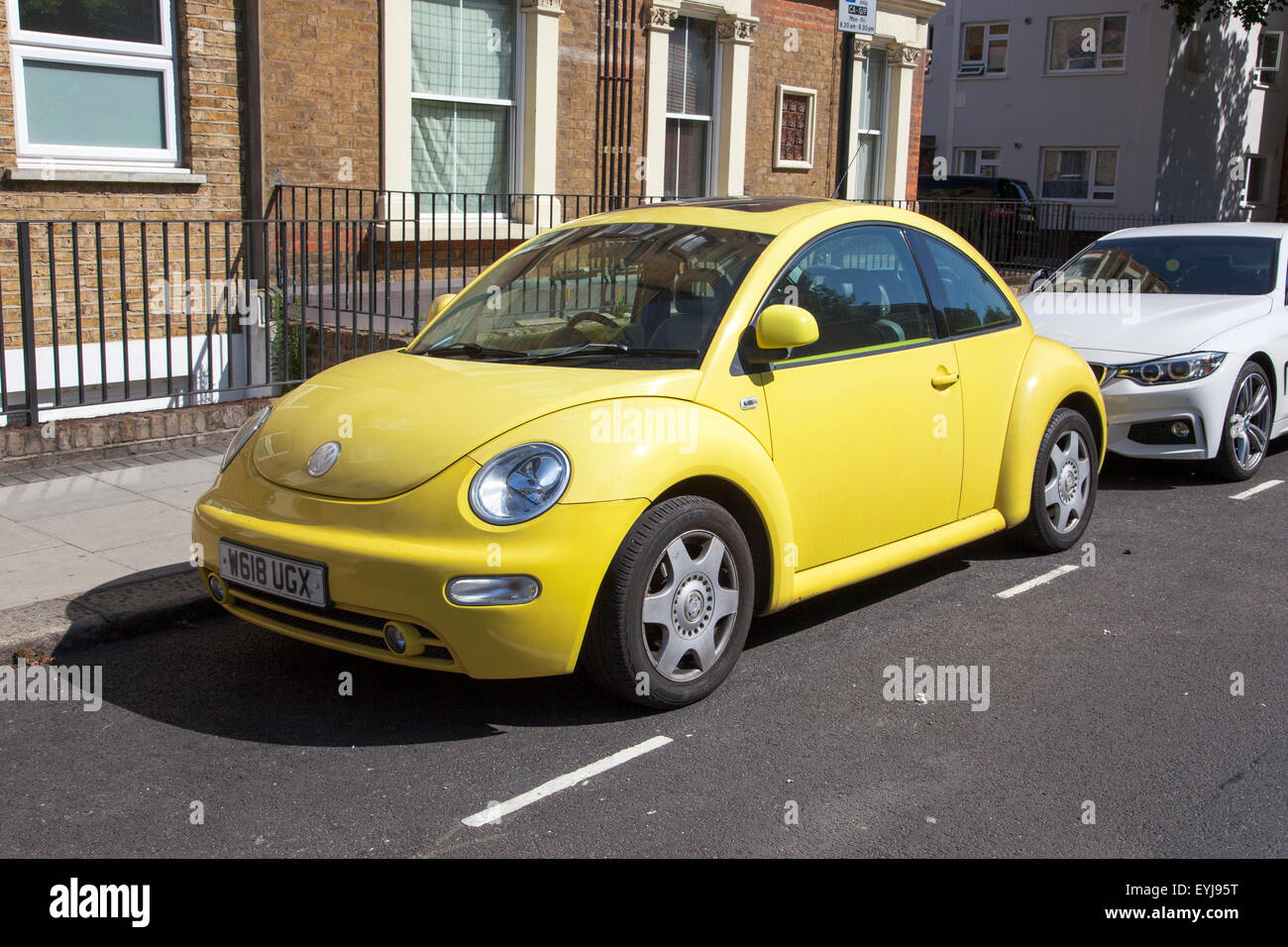 Yellow Volkswagen Beetle Stock Photo