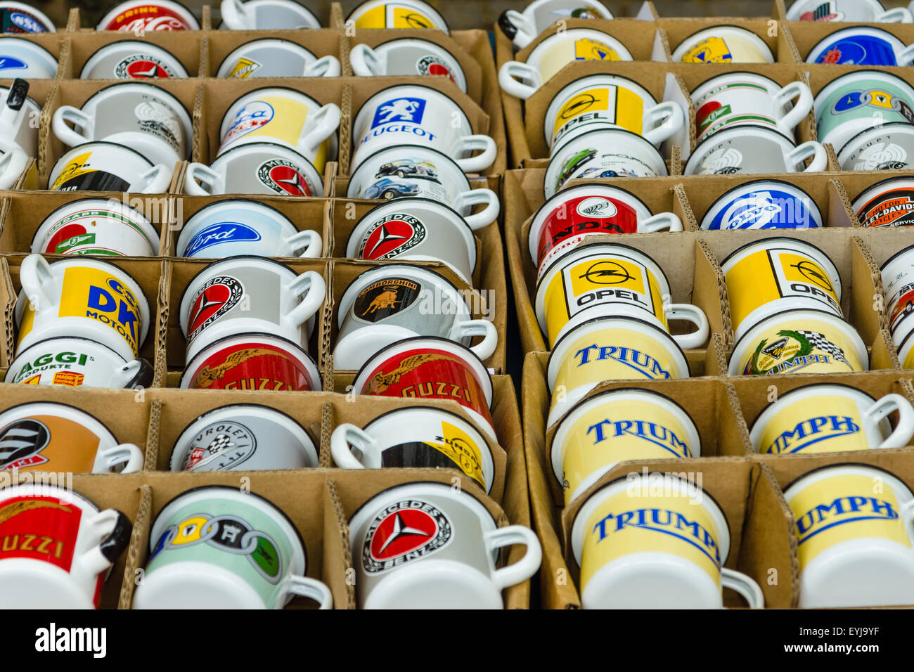 BERLIN - JUNE 14, 2015: Background of enamel mugs with logos of automobile firms. The Classic Days on Kurfuerstendamm. Stock Photo