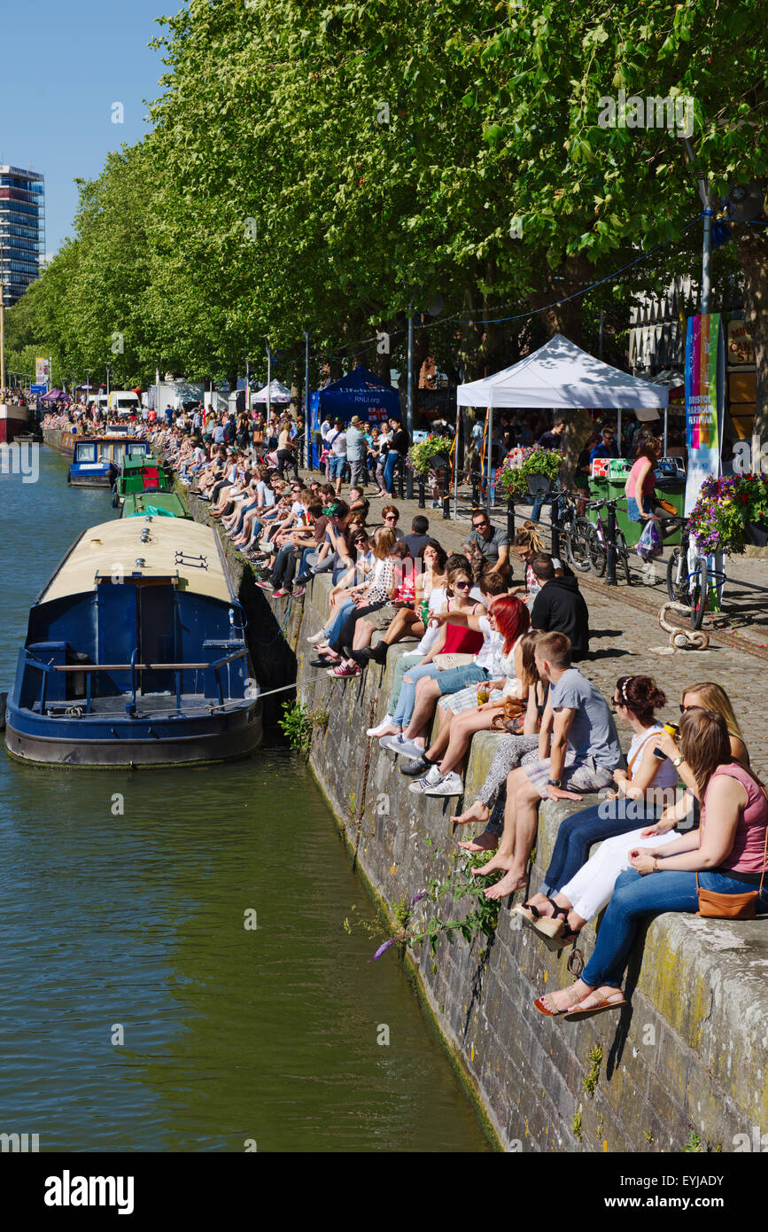 Visiting people and canal boats along Narrow Quay of St Augustine's Reach of Bristol floating harbour during harbour festival Stock Photo