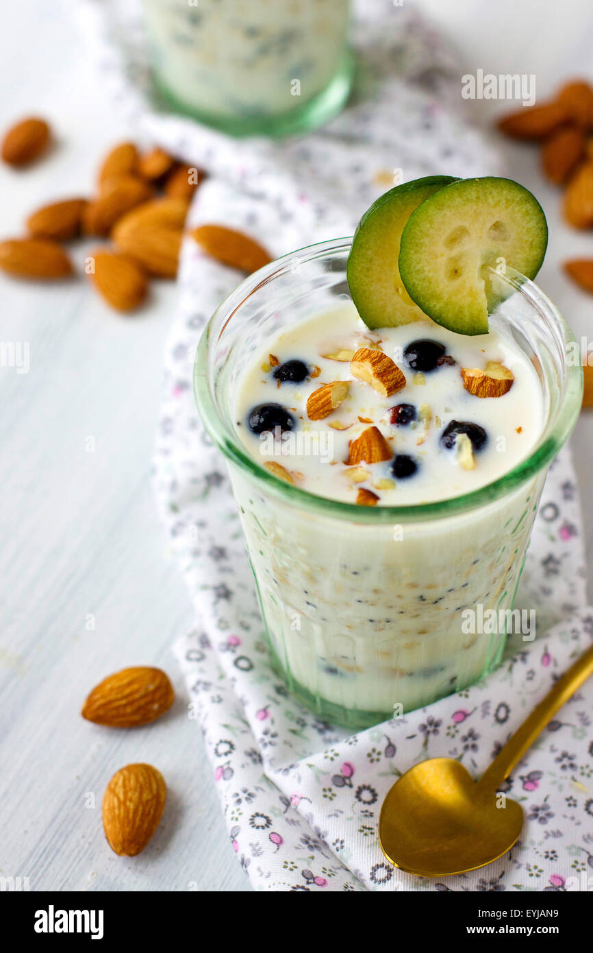 Portion of overnight oats with berries and nuts Stock Photo Alamy