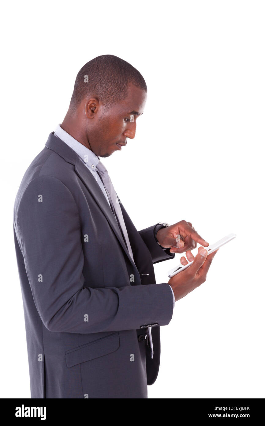 African american business man using a tactile tablet over white ...