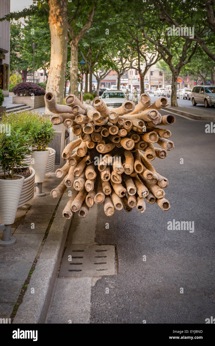 Bamboo poles used for scaffold on a handcart Stock Photo