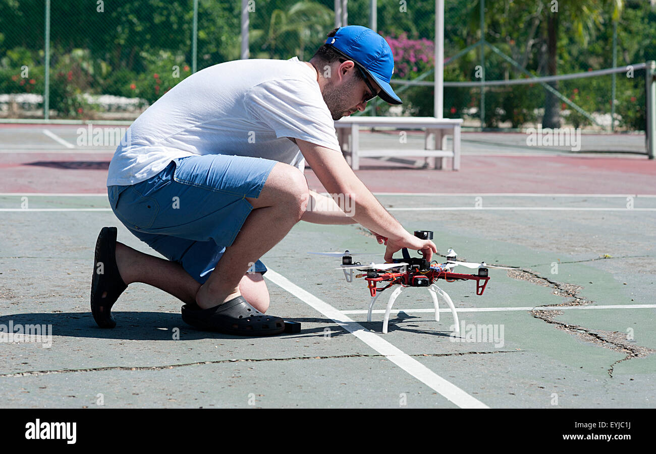 Young man checks drone before flight. Stock Photo