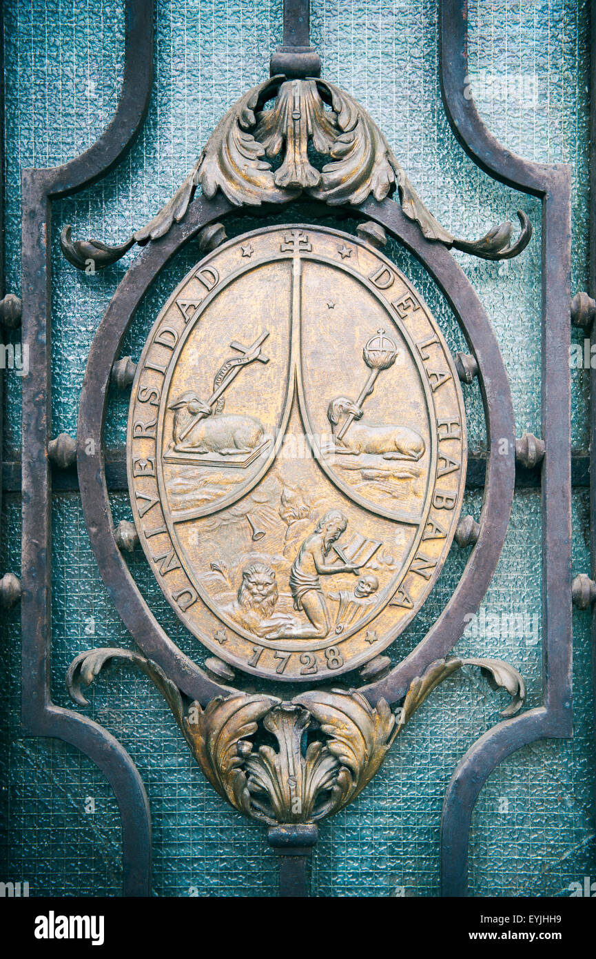 HAVANA, CUBA - MAY, 2011: Seal of the University of Havana, founded in 1728, installed on an entrance gate on the Vedado campus. Stock Photo