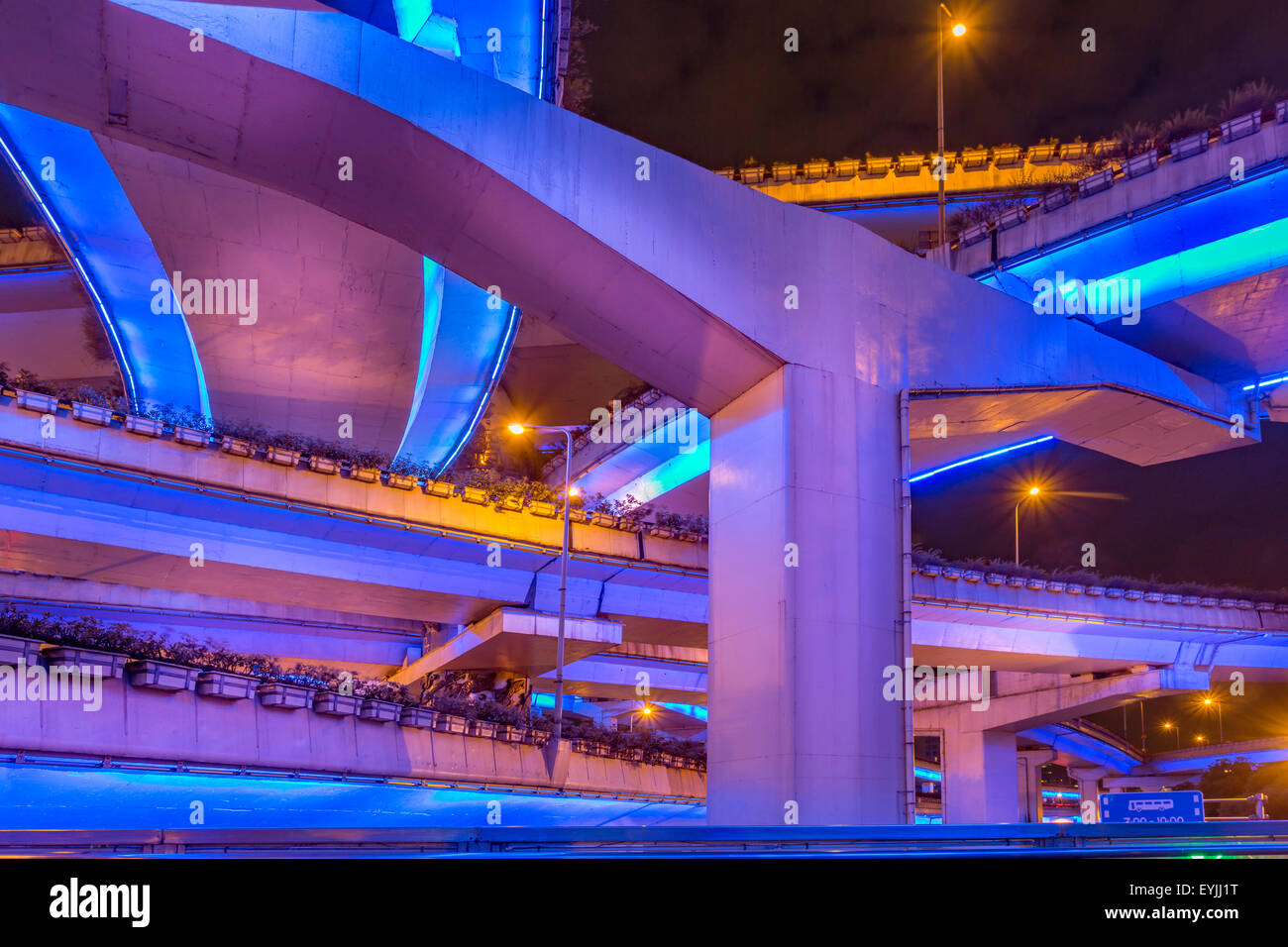 Illuminated bridges of the elevated highway system at night Stock Photo