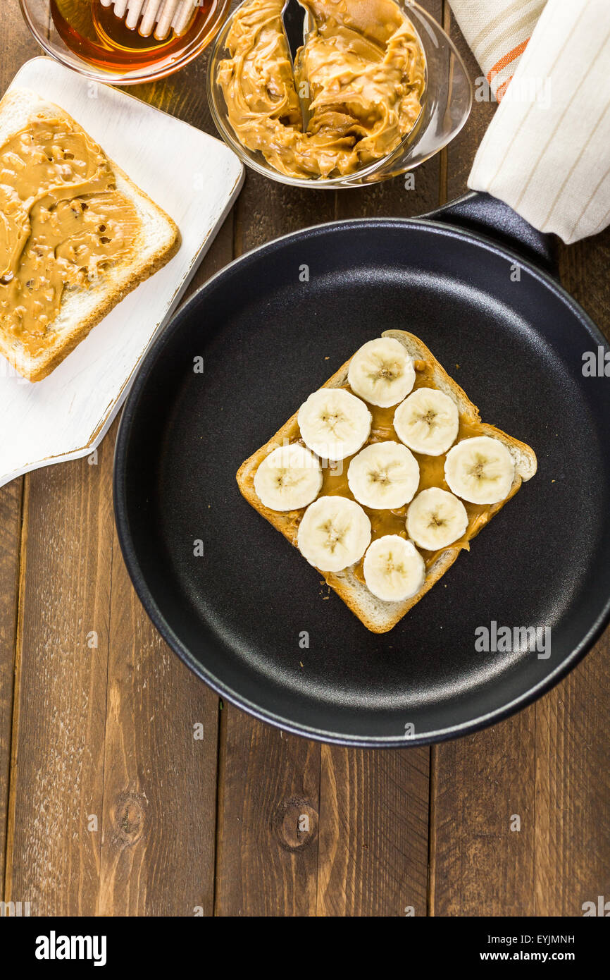 Homemade peanut butter and banana sandwich on white bread Stock Photo