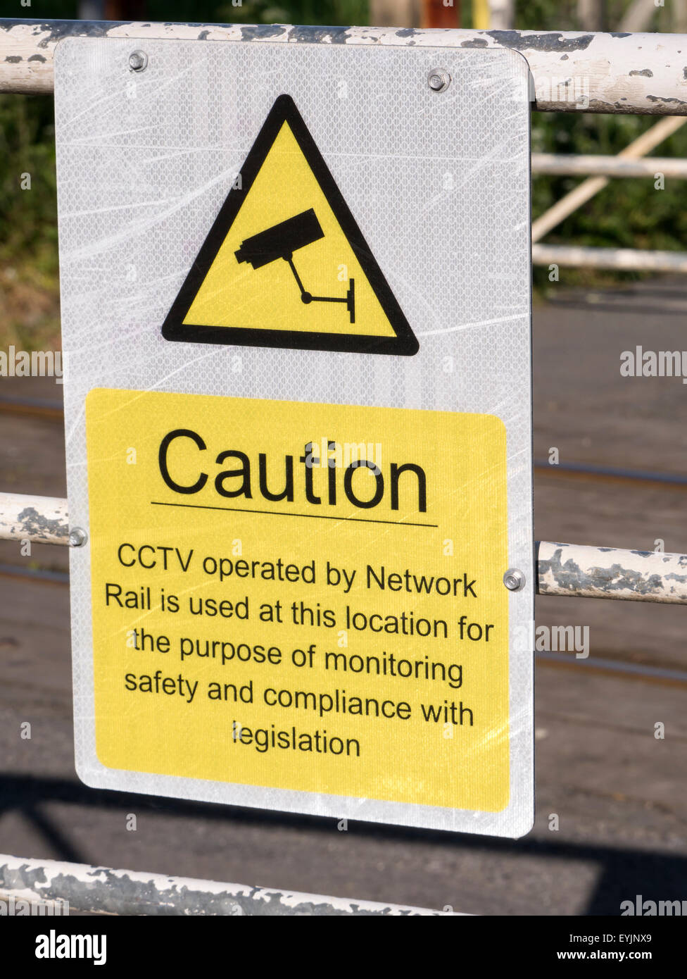 Caution sign at Unmanned Railway Crossing Stock Photo