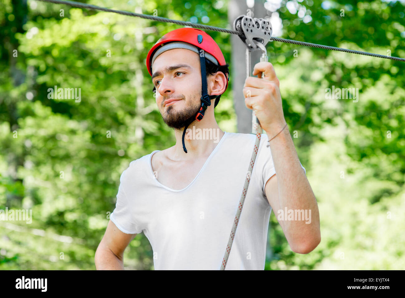 Man riding on a zip line Stock Photo Alamy
