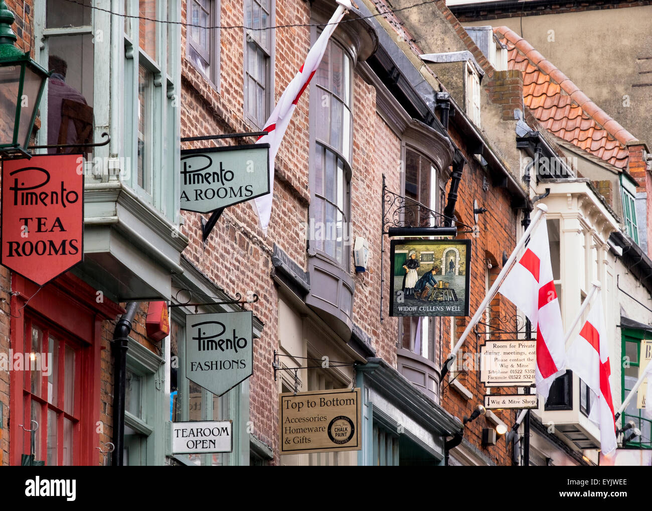 Variety of shop cafe and pub signs on the famous Steep Hill in Lincoln Stock Photo
