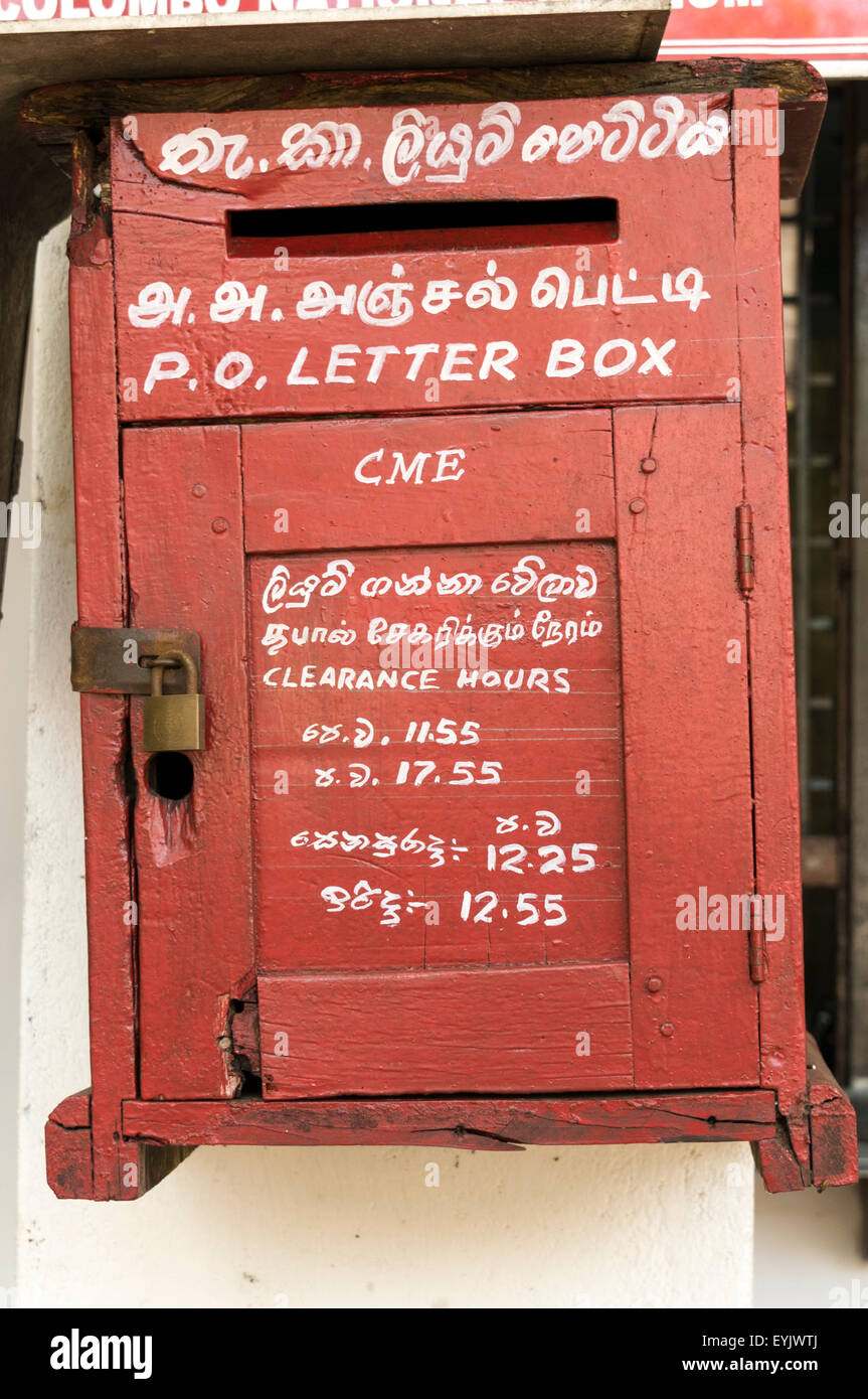 Old fashioned letter box in Singapore with both English and Tamil writing Stock Photo