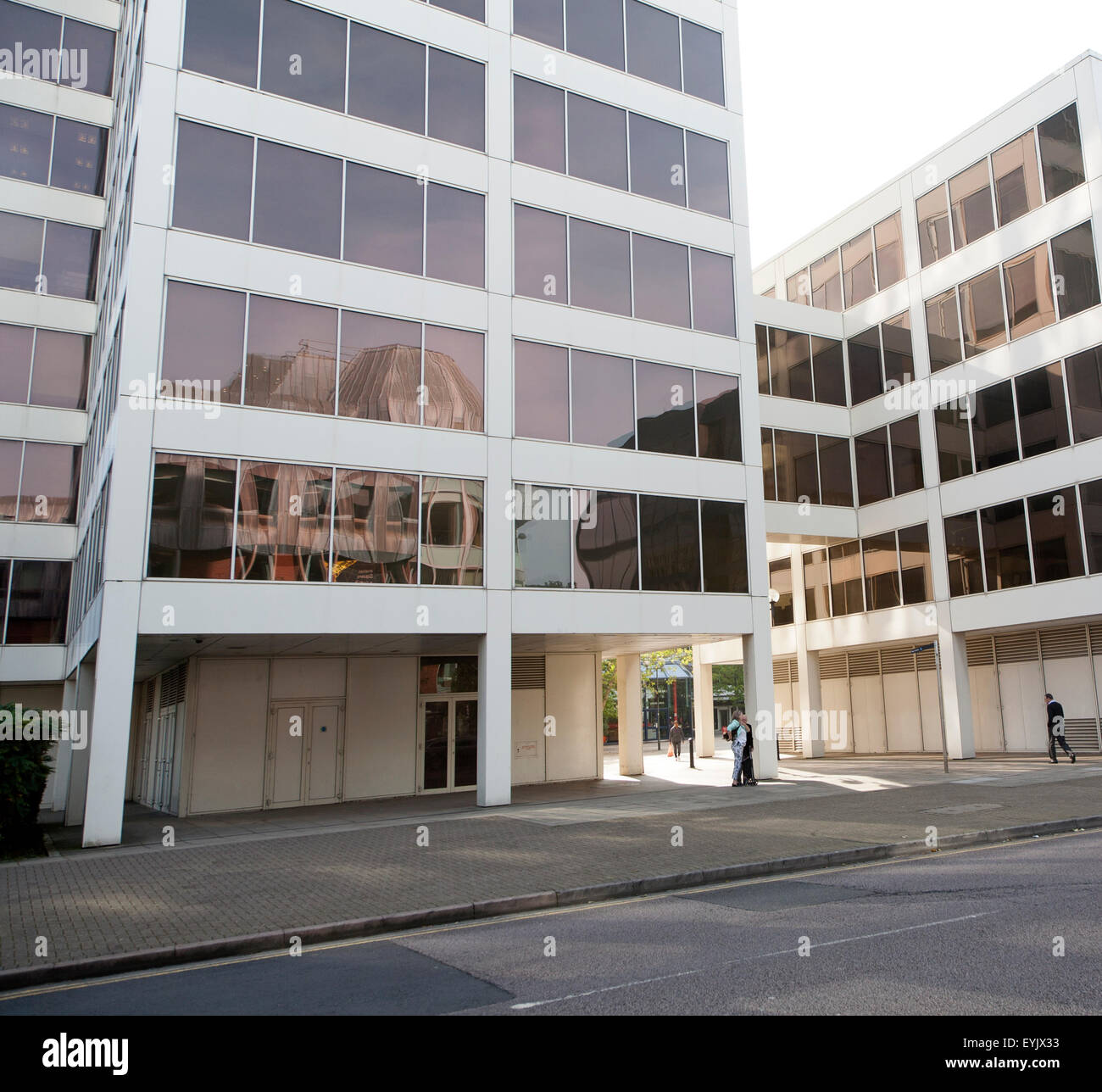 Modern architecture people walking between insurance company offices