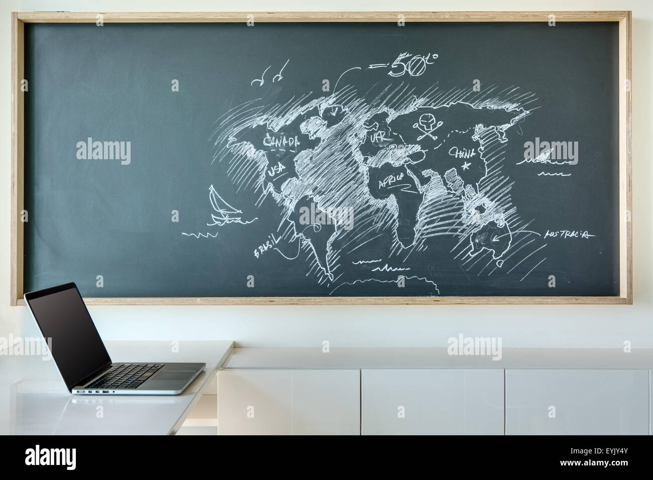 Painted white chalk map of the world in a humorous style Stock Photo