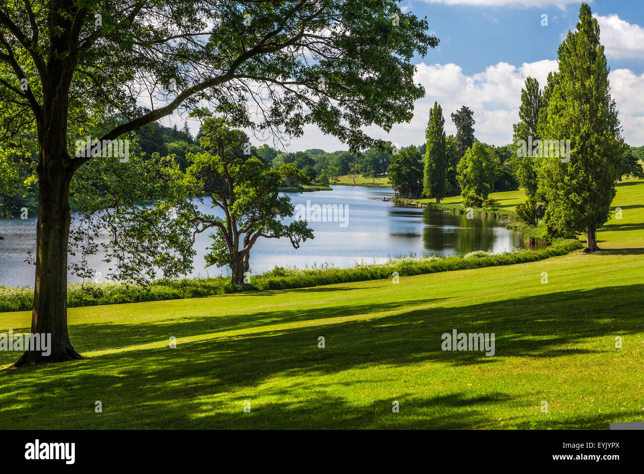 View of the lake and parkland at Bowood House in Wiltshire in the summer. Stock Photo