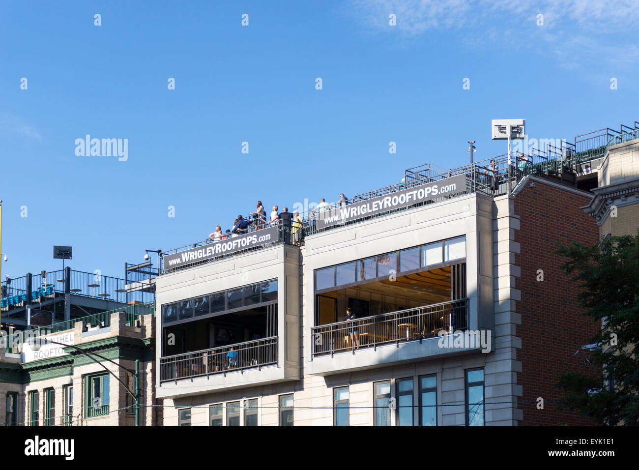 Wrigley Rooftops - private enterprise seats on top of buildings surrounding Wrigley Field baseball ground. Stock Photo