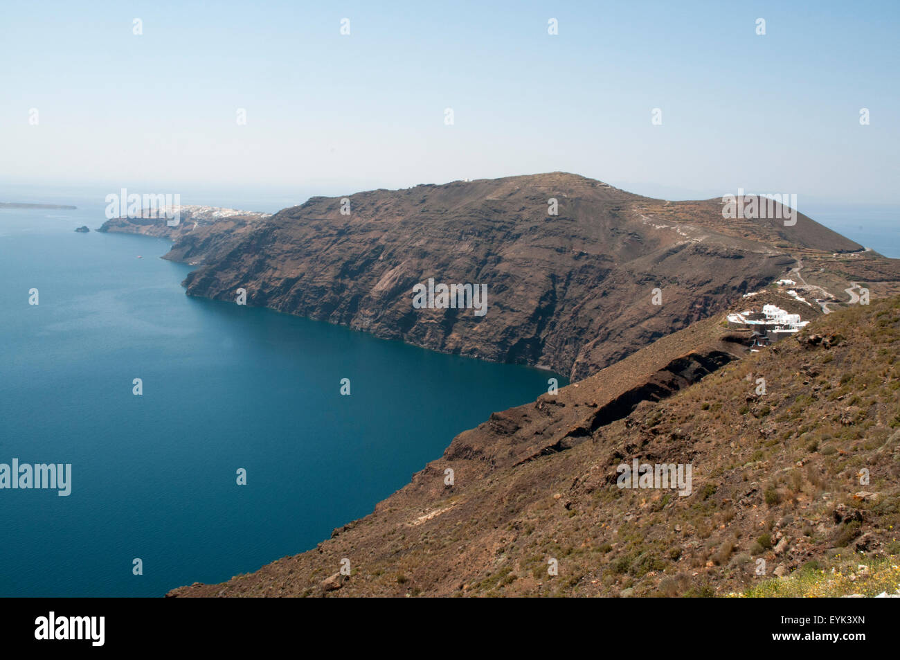 The picturesque villages at the top of this high walls of Santorini caldera are connected by a donkey path along the crater rim. Stock Photo