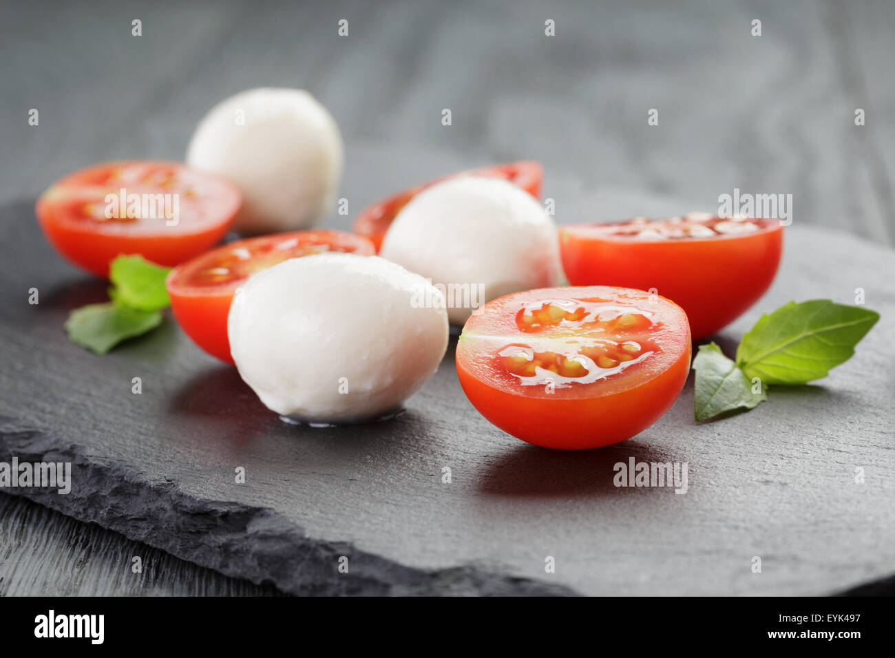 mozzarella balls with tomatoes and basil Stock Photo Alamy