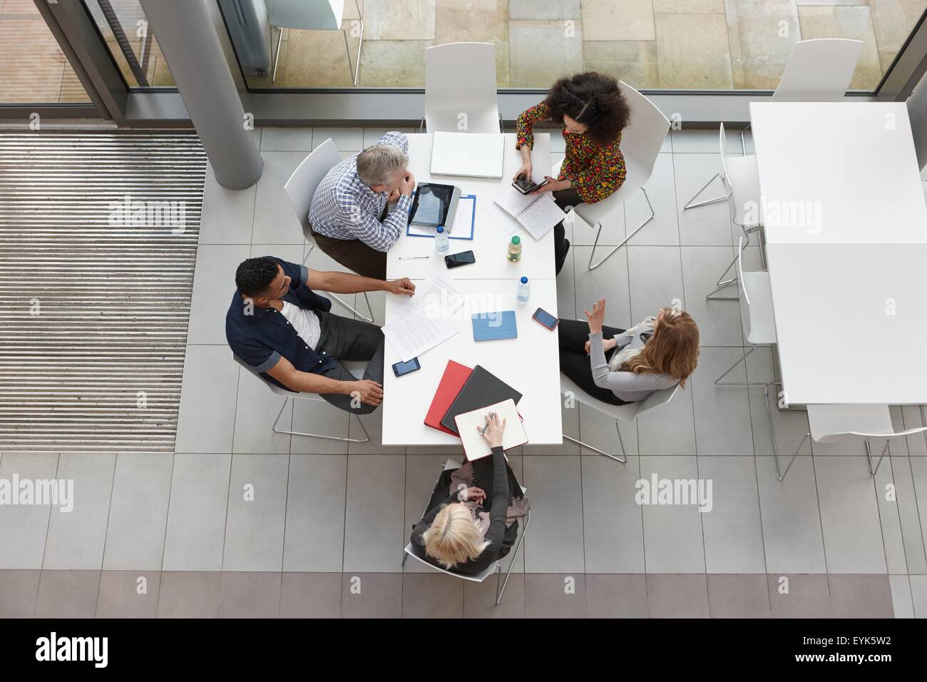 Overhead view of business team having meeting at conference table Stock Photo