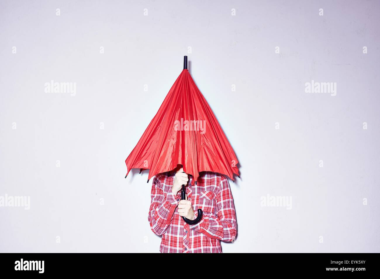 Man holding umbrella over woman hires stock photography and images Alamy