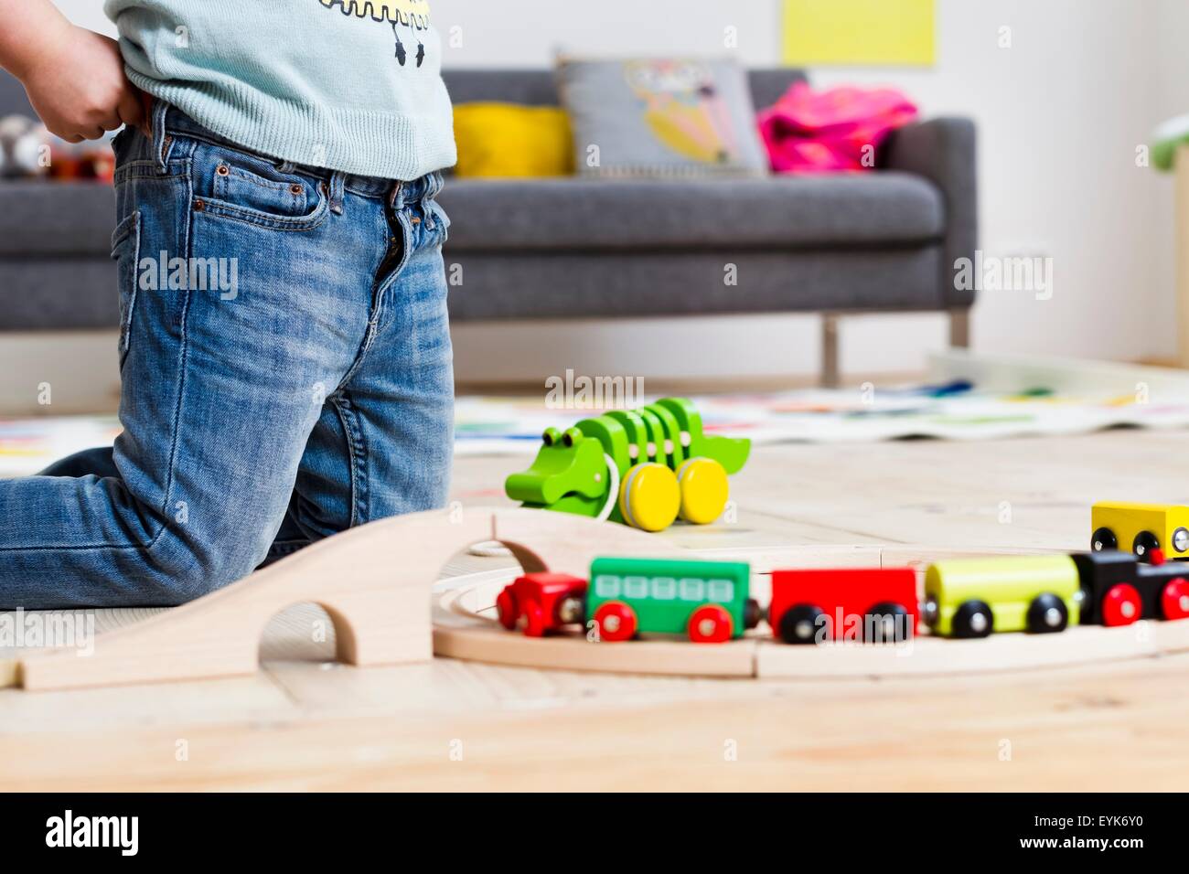 Girl playing with toy cars at home Stock Photo