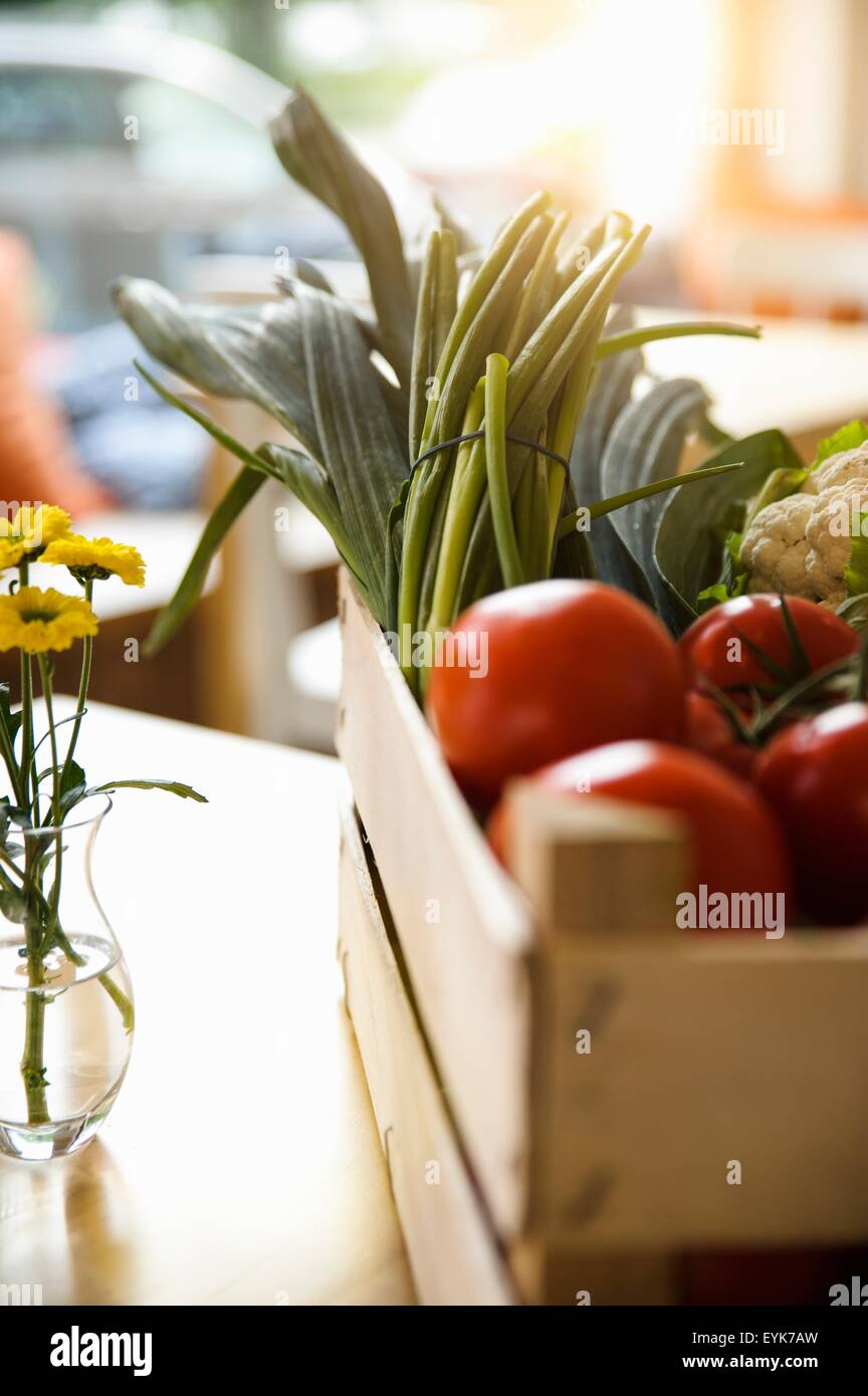 Crate of tomatoes and vegetables Stock Photo