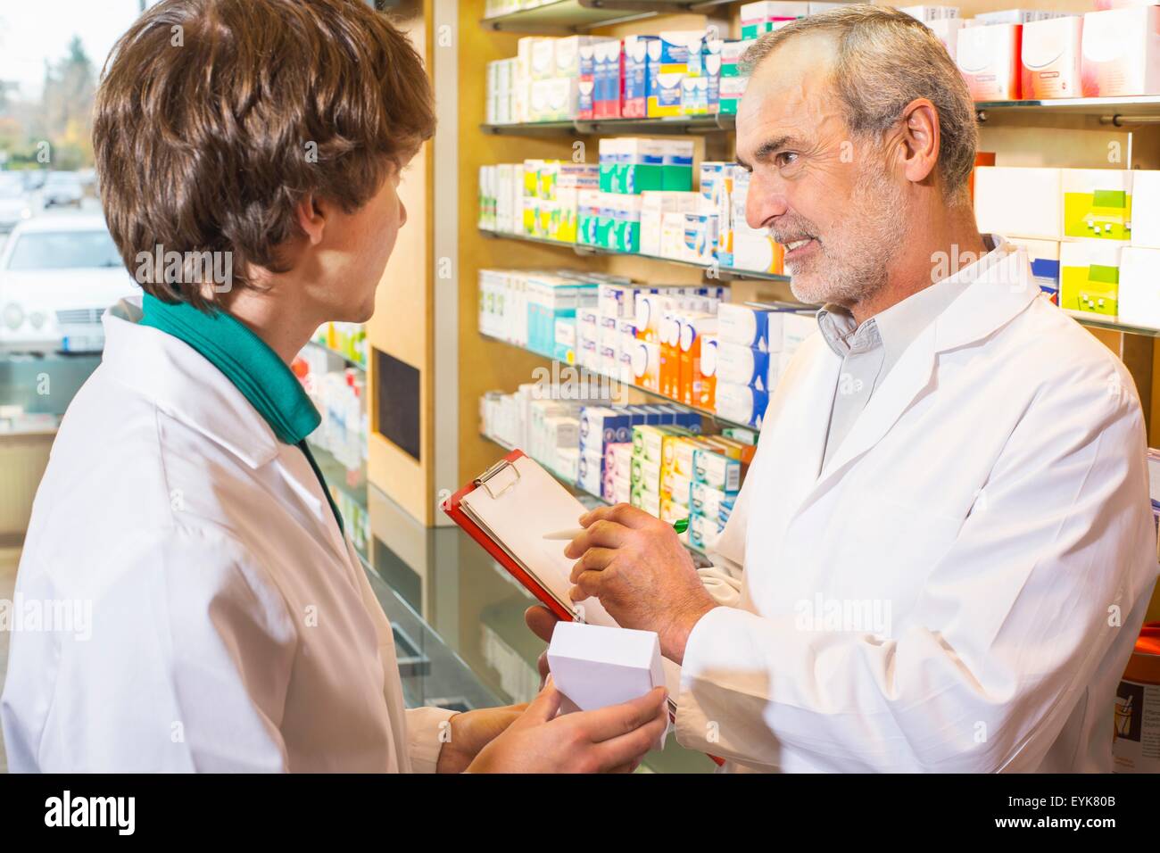Two pharmacists checking medicines in pharmacy Stock Photo