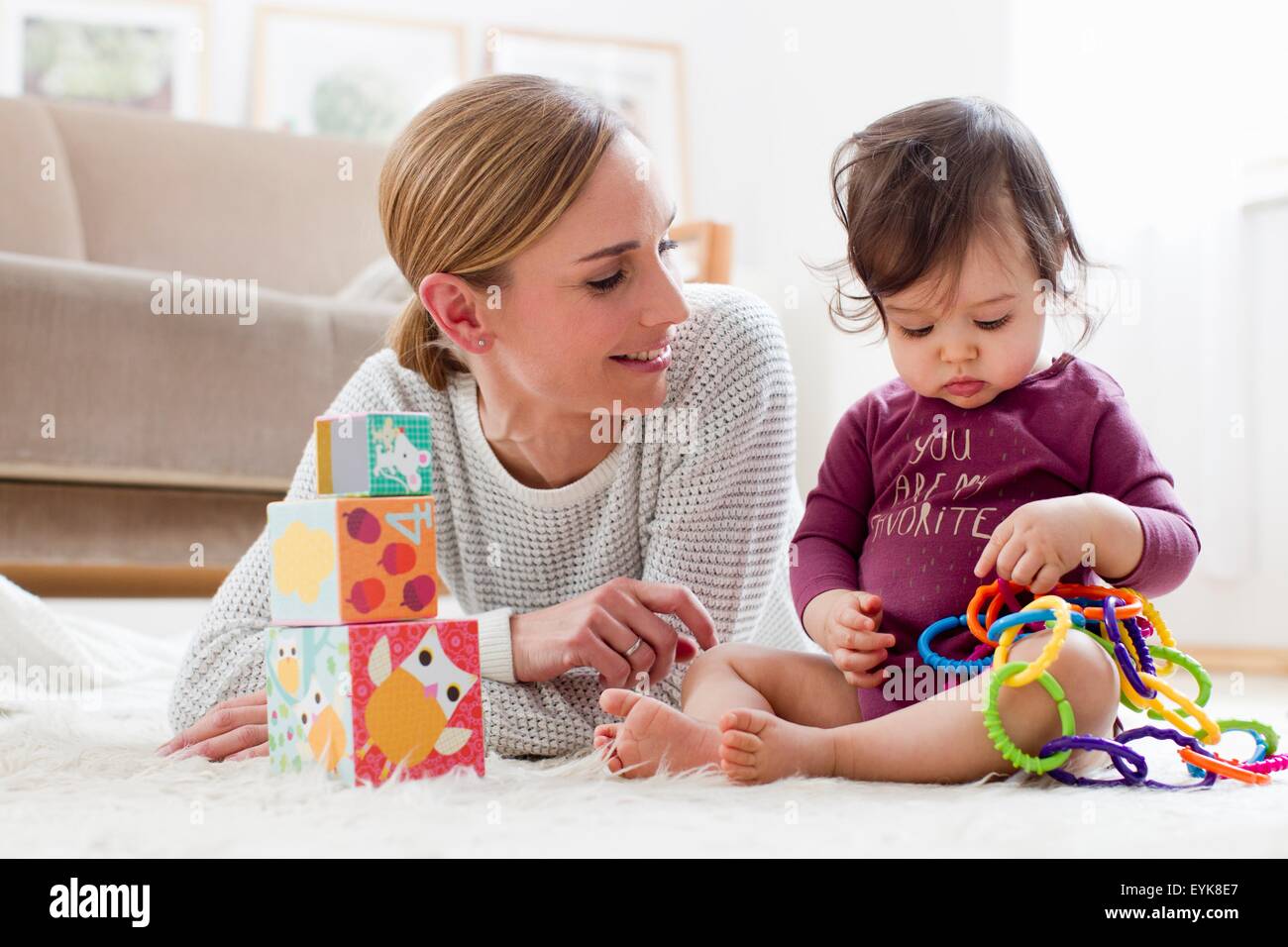 Mother and baby boy, at home, playing together Stock Photo
