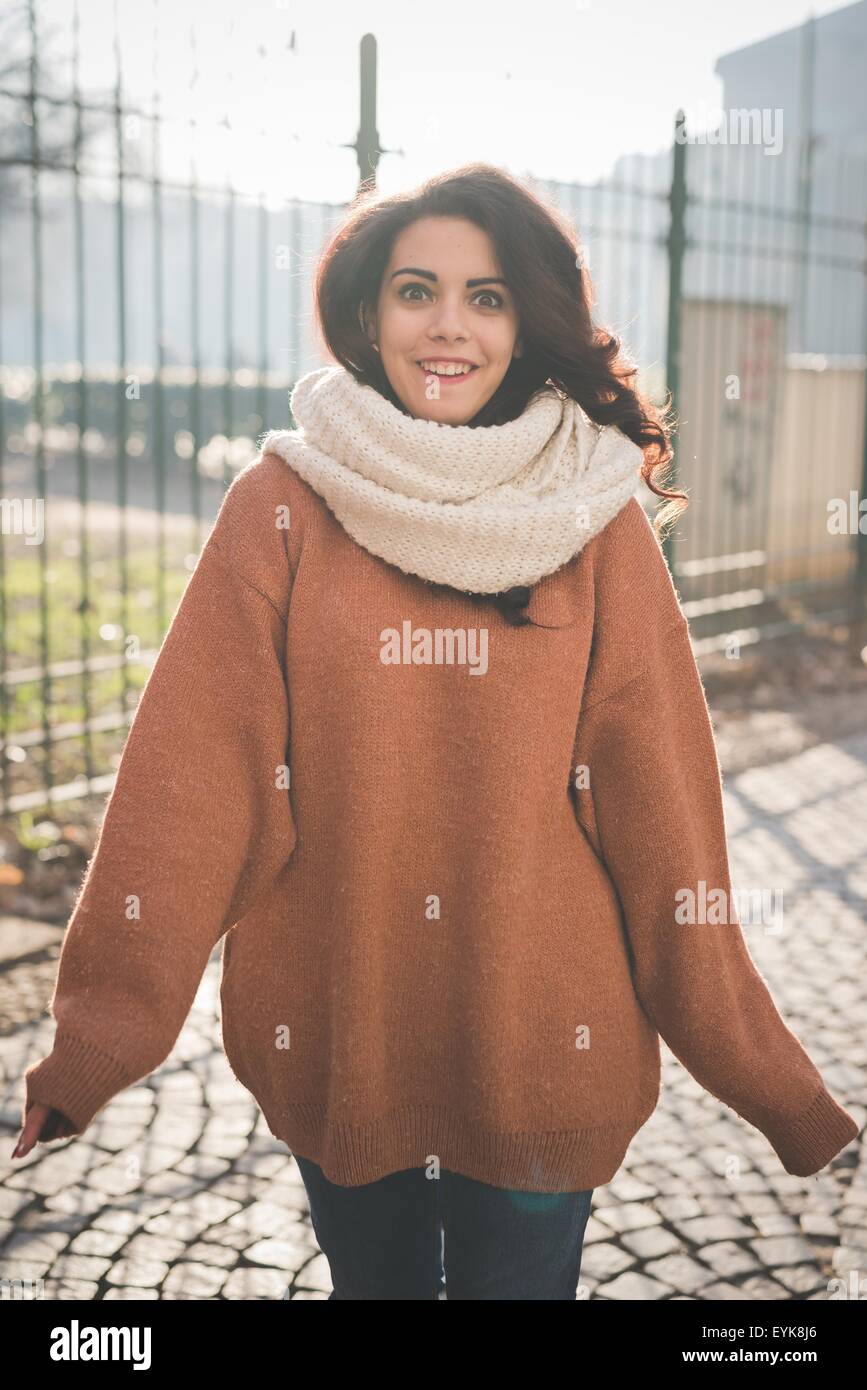 Portrait of beautiful young woman posing in park Stock Photo - Alamy