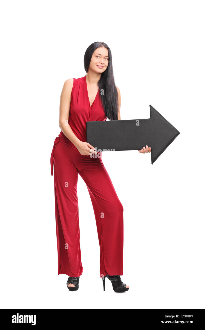 Full length portrait of a young fashionable woman holding a big black ...