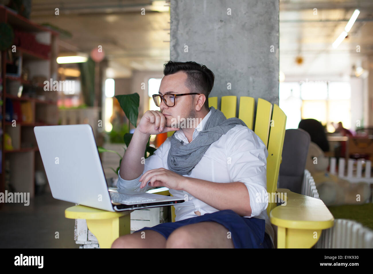 Trendy man working in startup office Stock Photo