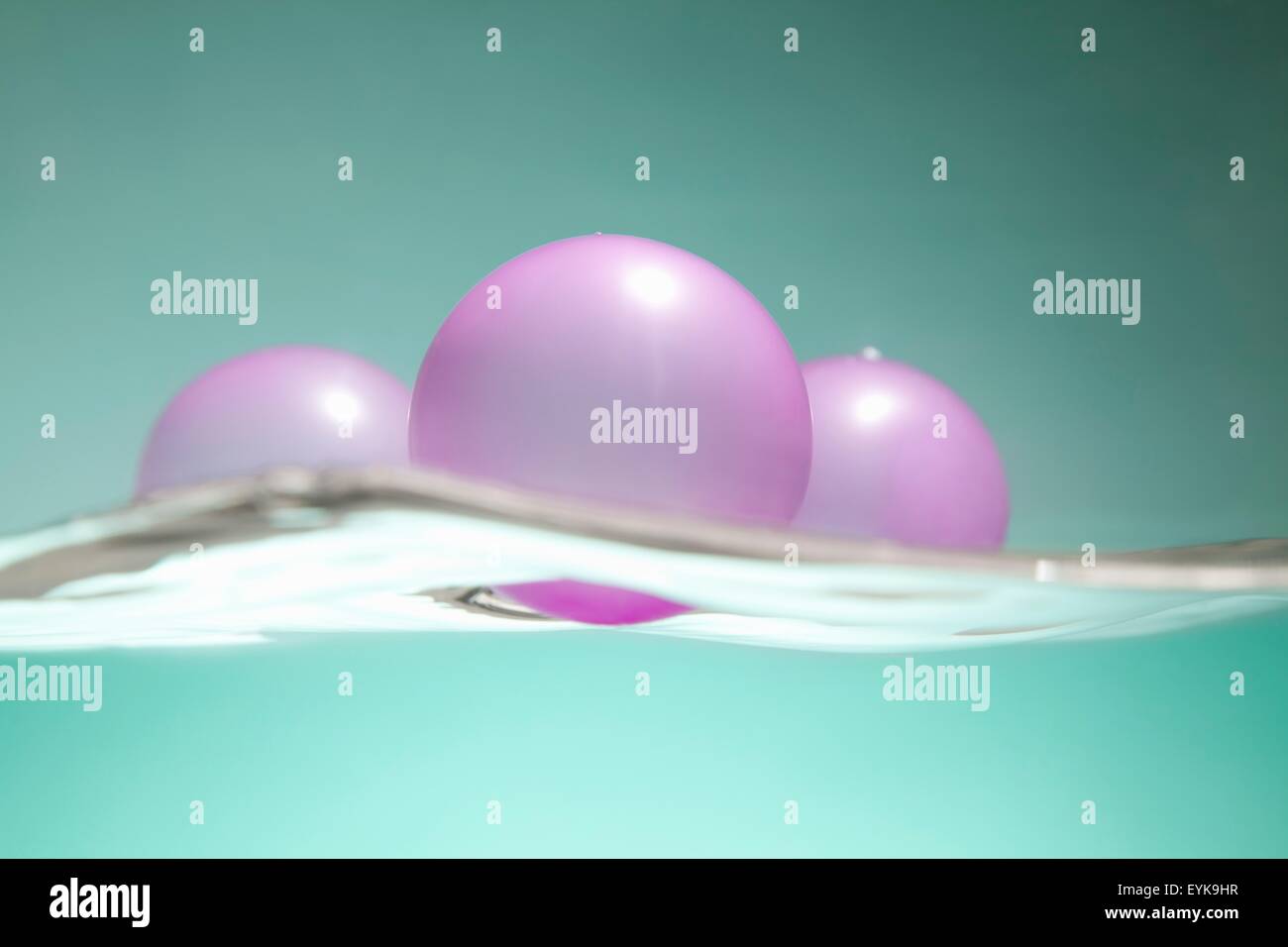 Pink balloons floating on water surface Stock Photo Alamy