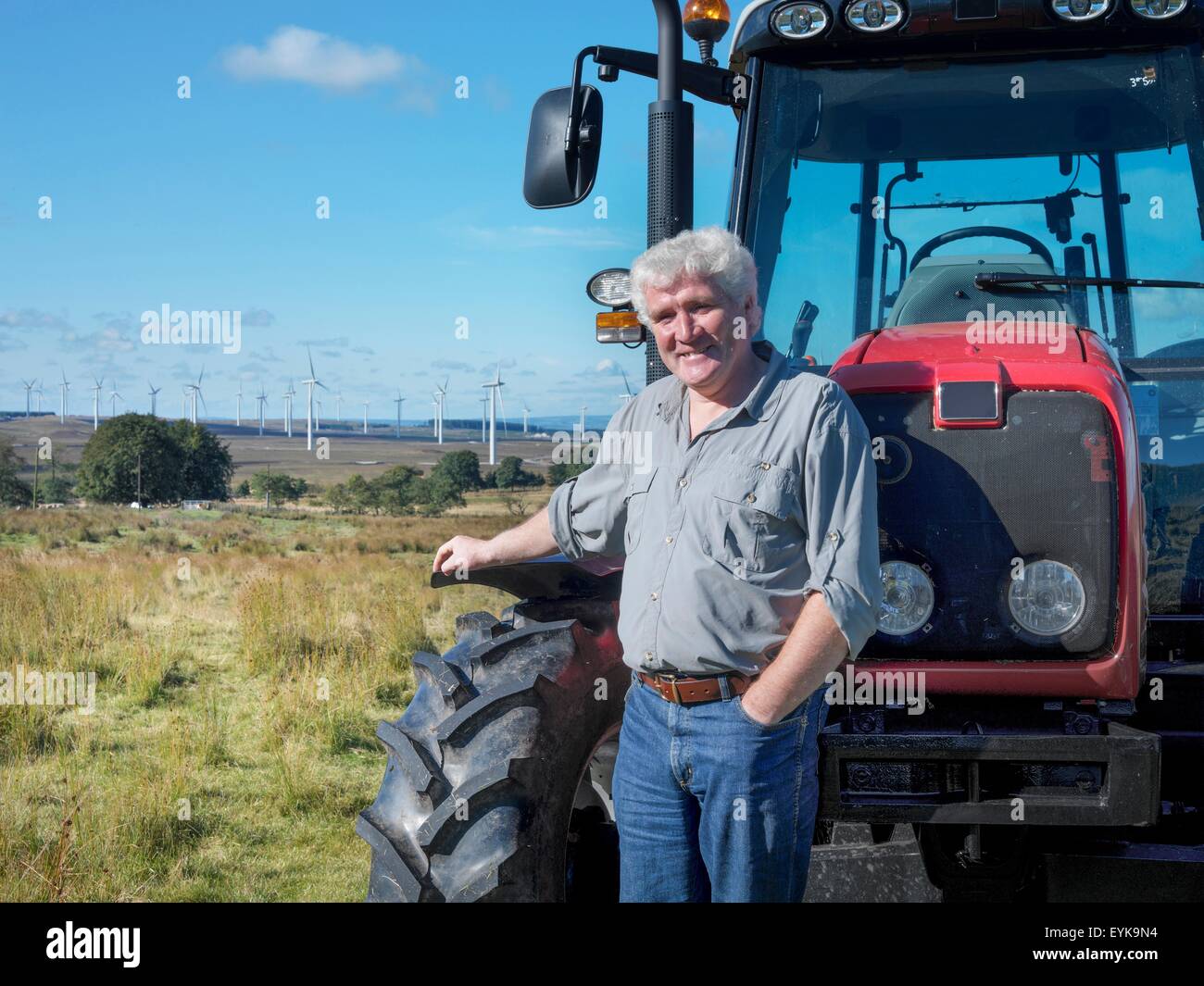 Portrait of farmer and landowner with windfarm in background Stock Photo