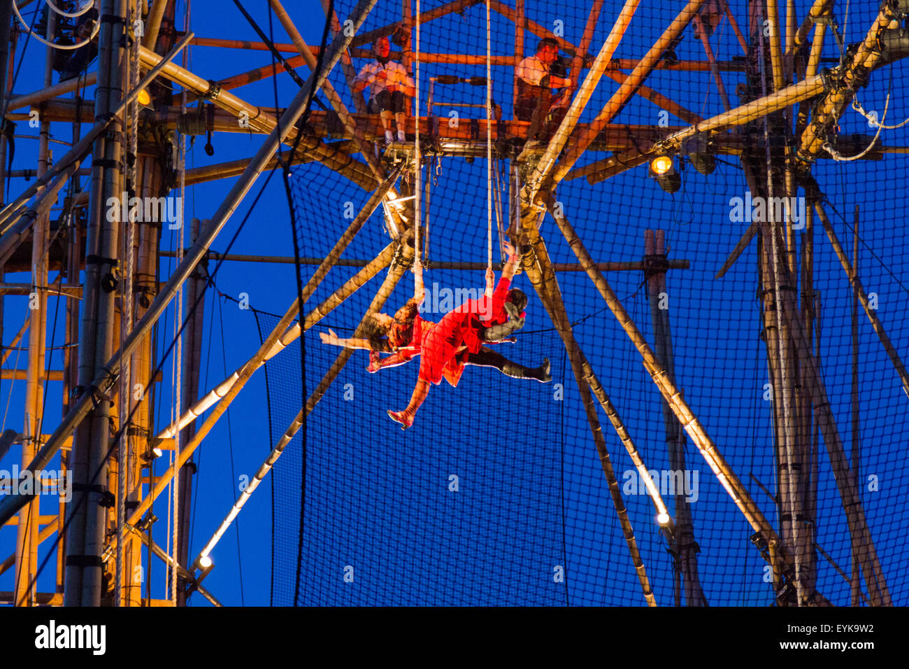 Stockton-on-Tees, UK, Thursday, 30 July, 2015. French circus company CirkVOST perform BoO, an open air aerial trapeze show, on a 15-metre high structure of 368 assembled bamboo poles. Credit:  Andrew Nicholson/Alamy Live News Stock Photo