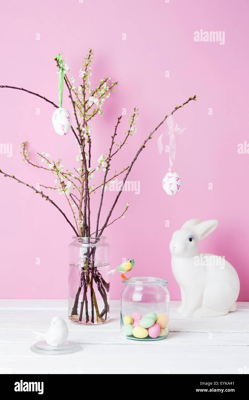 Still life of blossom twigs, Easter bunny and birds Stock Photo
