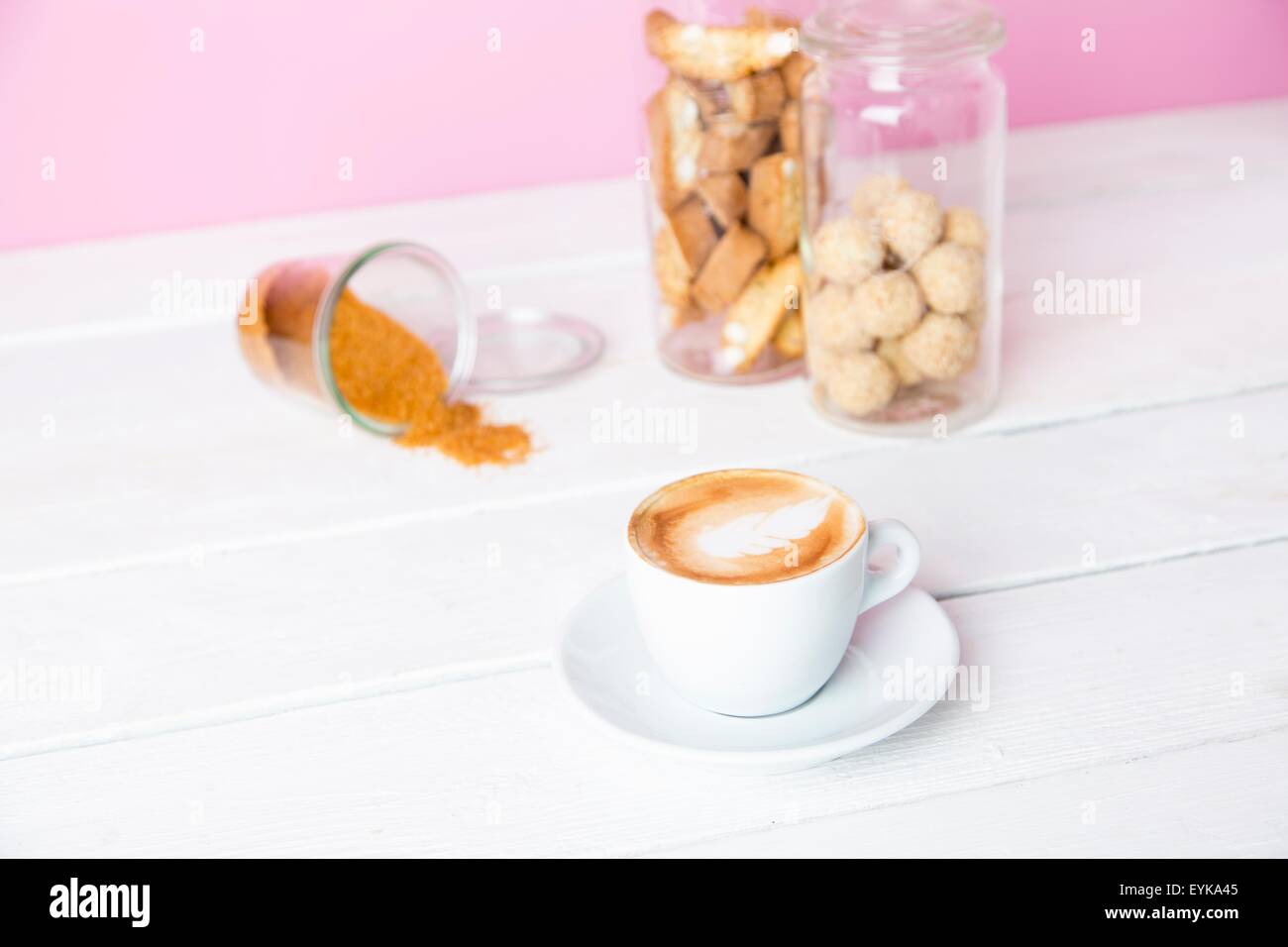 Still life of cup of coffee and cookie jars Stock Photo