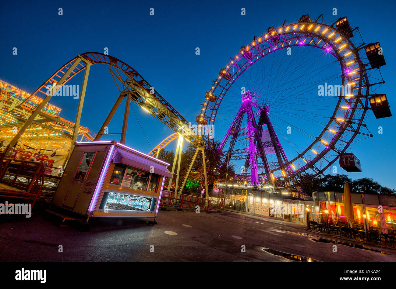 Amusement park in the Prater, Vienna. The famous Riesenrad illuminated at night. Stock Photo