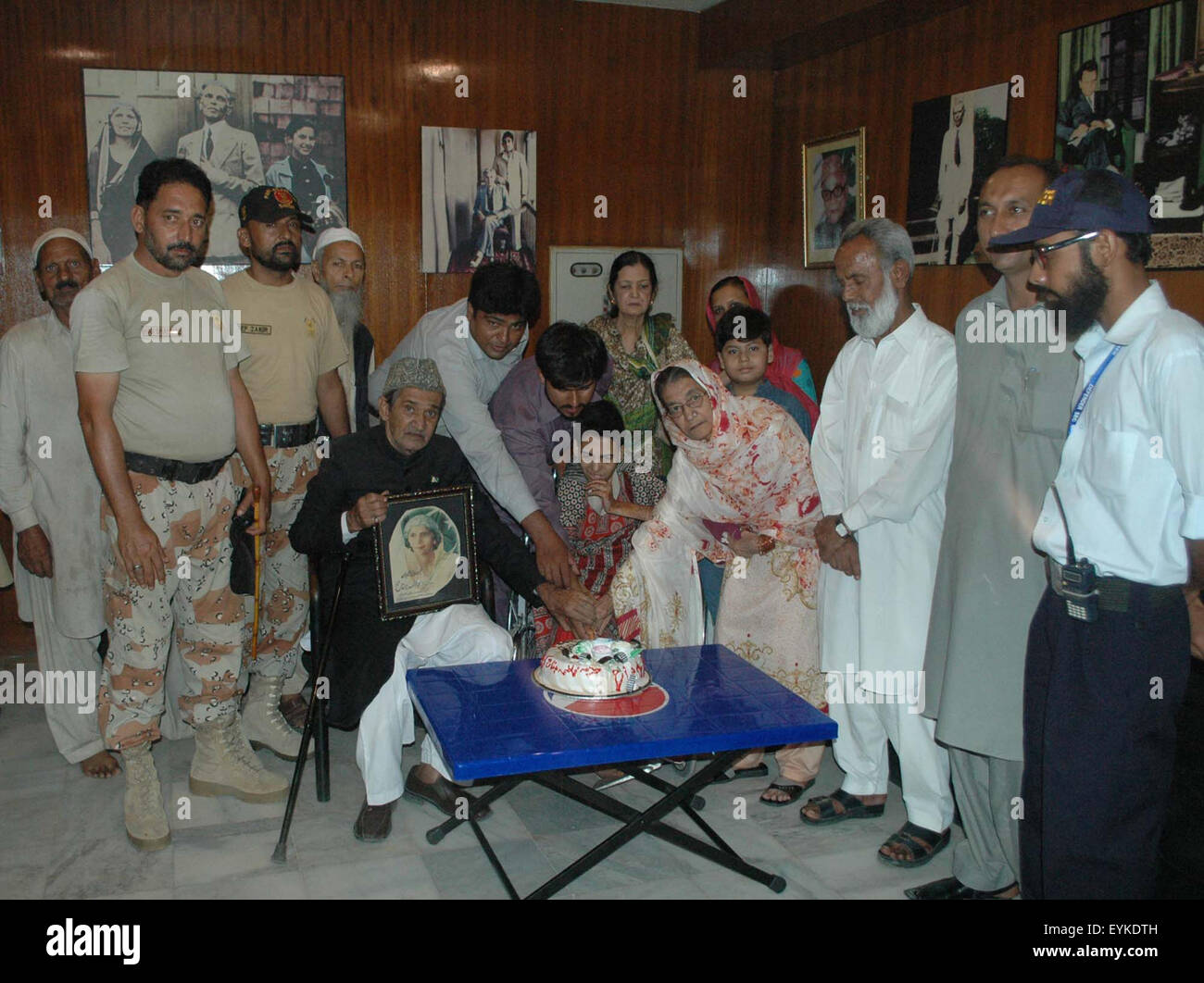 Jinnah Family members are cutting cake on the occasion of birthday anniversary of Fatima Jinnah, younger sister of Founder of Pakistan Quaid-e-Azam Muhammad Ali Jinnah, at Quaid's Mausoleum office in Karachi on Friday, July 31, 2015. Stock Photo