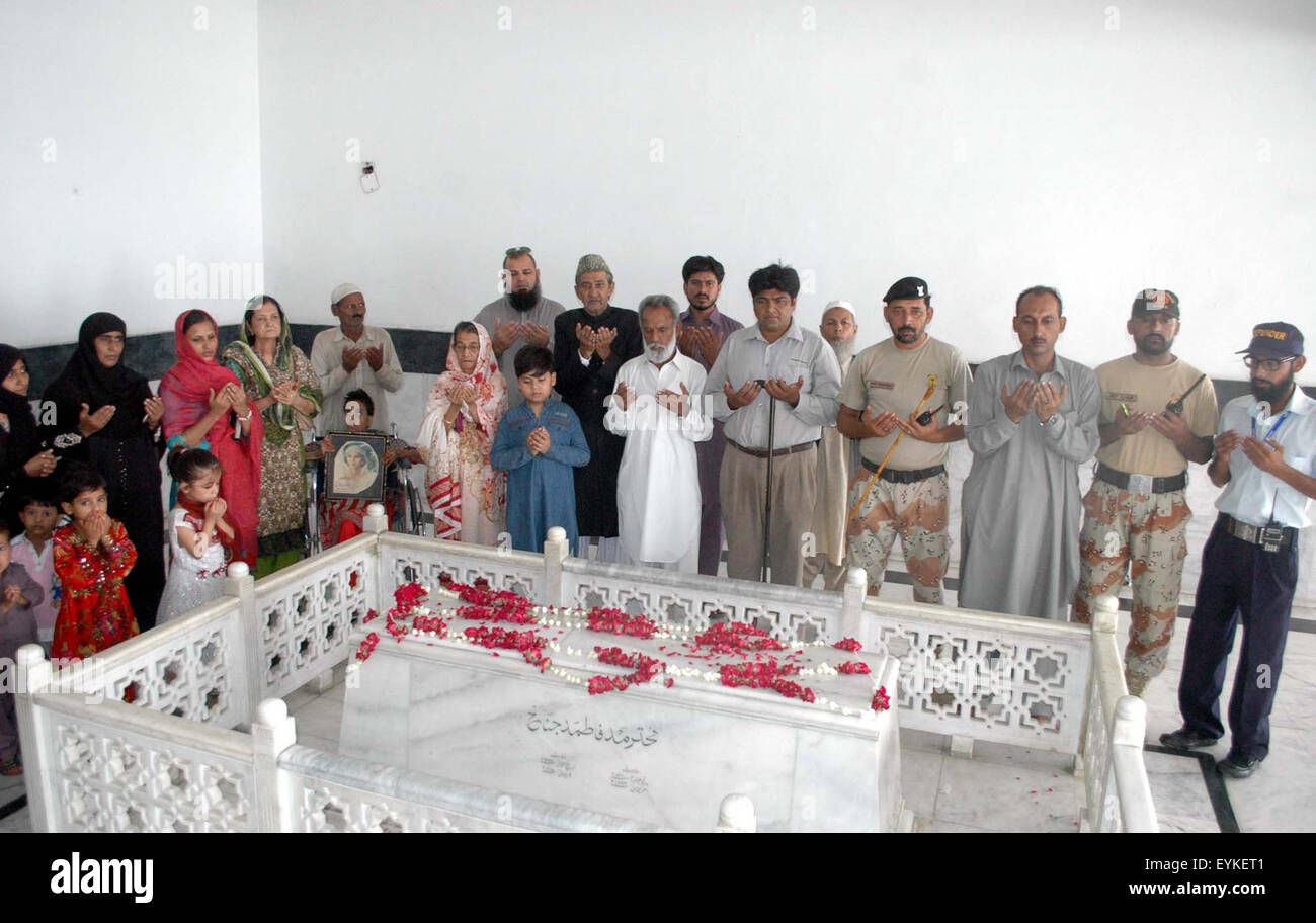 Jinnah Family members are offering prayer for departed soul of Fatima Jinnah, younger sister of Founder of Pakistan Quaid-e-Azam Muhammad Ali Jinnah on occasion of her birthday anniversary, on Fatima's grave in Karachi on Friday, July 31, 2015. Stock Photo