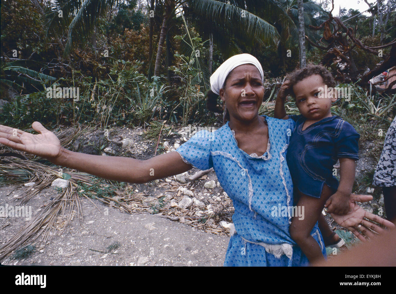 Haitian mother grieves just days after Hurricane Allen struck Haiti in 1980. Taken near Les Cayes, Haiti. Stock Photo