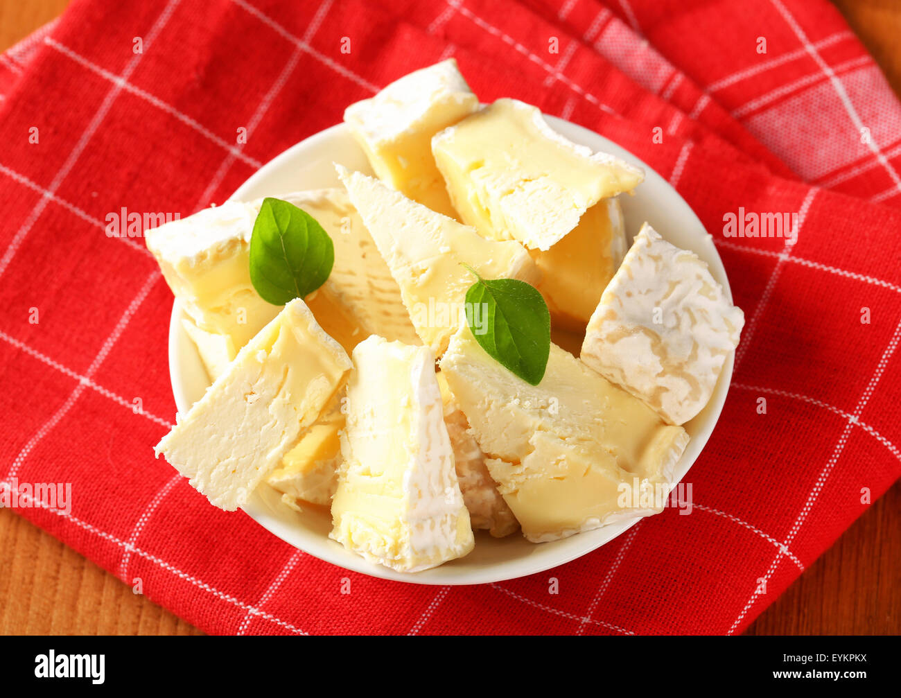 Pieces of French white rind cheese in a bowl Stock Photo Alamy